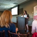 Christy Parker speaking at 100 WWC meeting